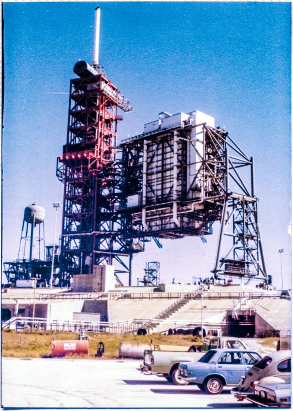 Image 052. The Rotating Service Structure at Space Shuttle Launch Complex 39-B, Kennedy Space Center, Florida, constructed by Union Ironworkers from Local 808 working for Wilhoit Steel Erectors, shows no outward sign that it has just completed one-third of a full pirouette, pivoting its colossal mass of four million pounds back around to the position which had occupied during the years of its initial construction phase, completing its first proof-test rotational demonstration that it was in fact designed well, and built well. Photograph by James MacLaren. Image 052. The Rotating Service Structure at Space Shuttle Launch Complex 39-B, Kennedy Space Center, Florida, constructed by Union Ironworkers from Local 808 working for Wilhoit Steel Erectors, shows no outward sign that it has just completed one-third of a full pirouette, pivoting its colossal mass of four million pounds back around to the position which had occupied during the years of its initial construction phase, completing its first proof-test rotational demonstration that it was in fact designed well, and built well. Photograph by James MacLaren.
